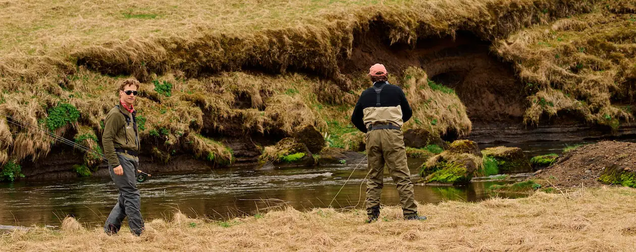Fly fishermen by a river